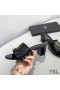 Yves Saint Laurent Monogram Heeled Slides In Stone Grain Leather Black