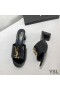Yves Saint Laurent Monogram Heeled Slides In Stone Grain Leather Black