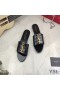 Yves Saint Laurent Monogram Slides In Alligator-Embossed Patent Leather Black