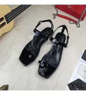 Yves Saint Laurent Cassandra Flat Sandals with Toehold Loop In Patent Leather Black