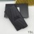 Yves Saint Laurent Stort Monogram Klaff Lommebok I Slipt Matelasse Skinn Sort