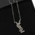 Yves Saint Laurent Opyum 펜던트 목걸이에 금속 및 실버 크리스탈