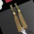 Naušnice Yves Saint Laurent Loulou S Кисточками-Lancem Od Чеканного Metala Zlatne Boje