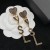 Yves Saint Laurent Opyum Corazón Pendientes En Metal Y Cristal De Oro