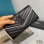 Yves Saint Laurent Grote Monogram Flap Portemonnee In Generfd Matelasse Leer Zwart/Wit