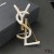 Yves Saint Laurent Opyum Broche In Metalen, Emaille en Kristallen, Goud/Wit